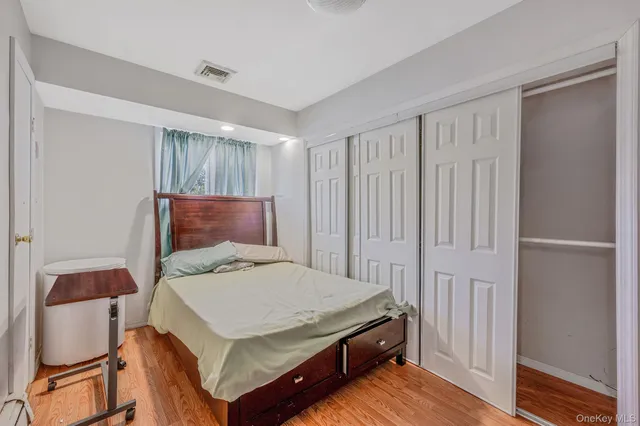 a bedroom with a bed and a closet