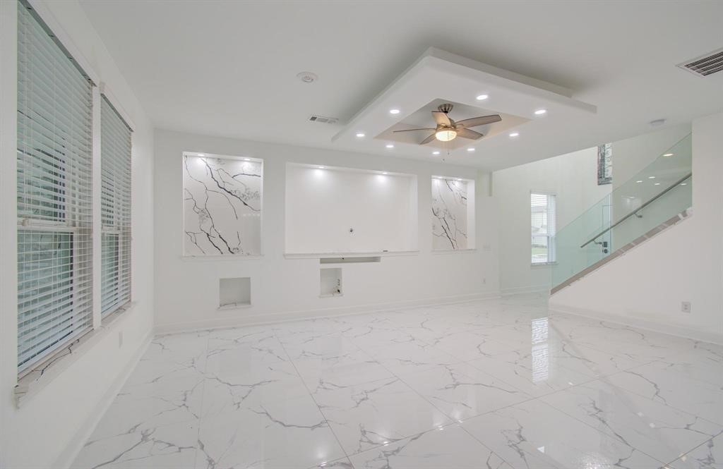 4627 Prairie Chase Drive Houston, TX 77069 - Photo 2 of 23 Elegant modern living room — Featuring refined finishes and a bright, upscale atmosphere.