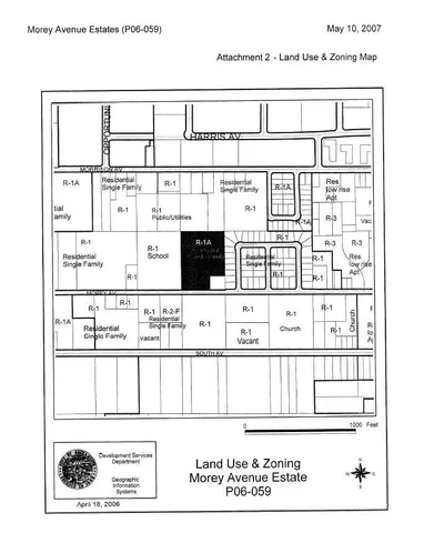 a black and white photo of a white house