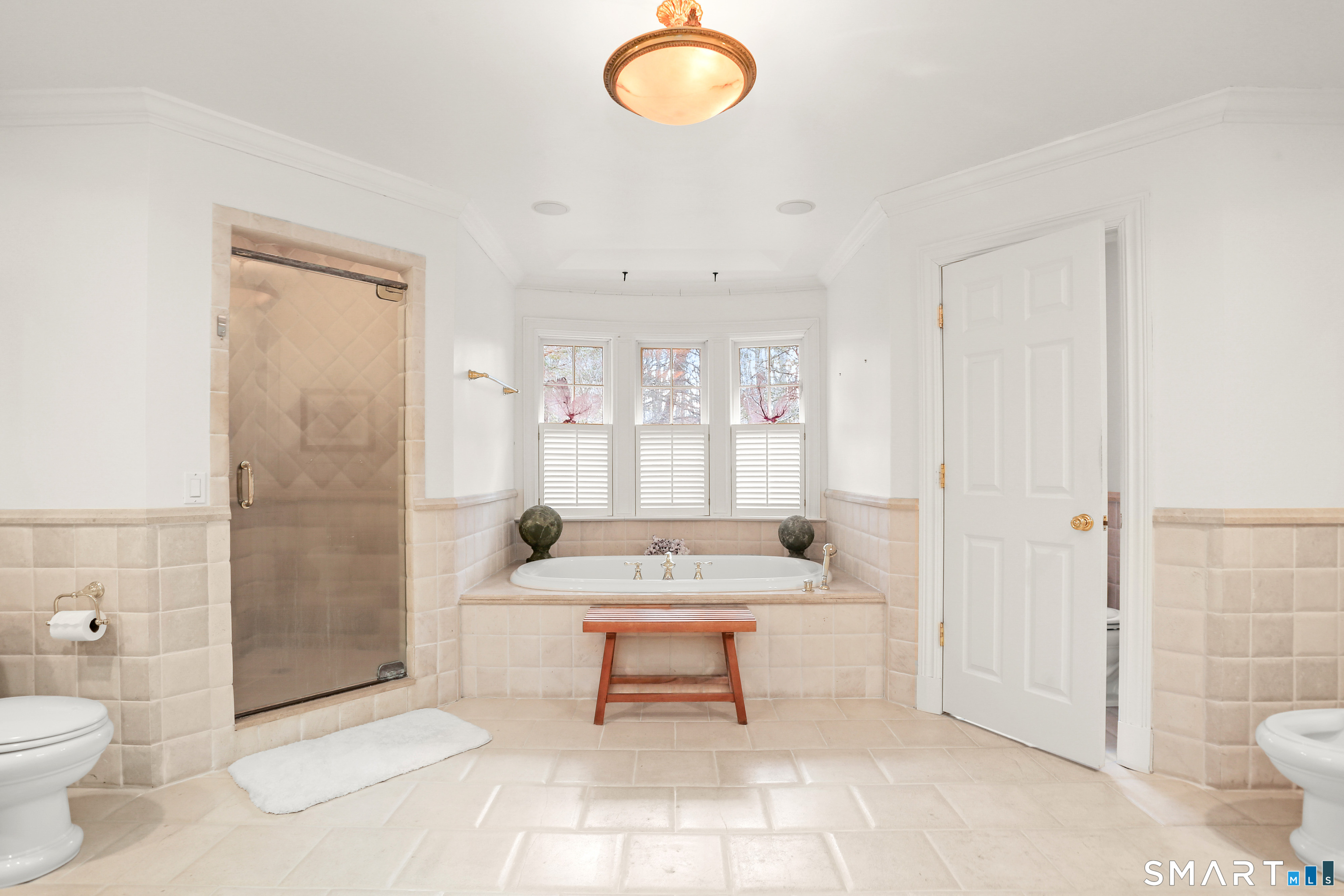 41 Lake Wind Road New Canaan, CT 06840 - Photo 15 of 38 a bathroom with a sink toilet and shower