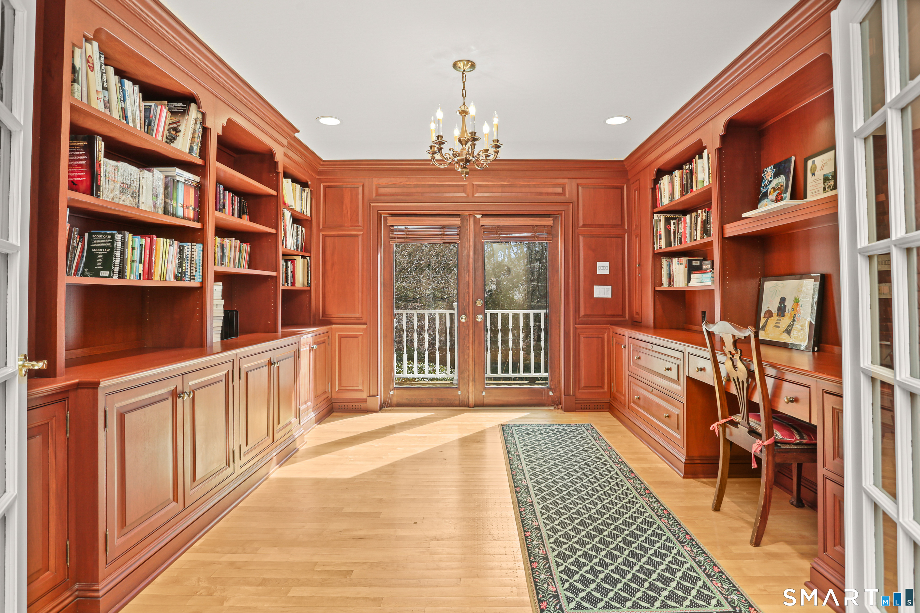 41 Lake Wind Road New Canaan, CT 06840 - Photo 17 of 38 a view of a balcony with furniture