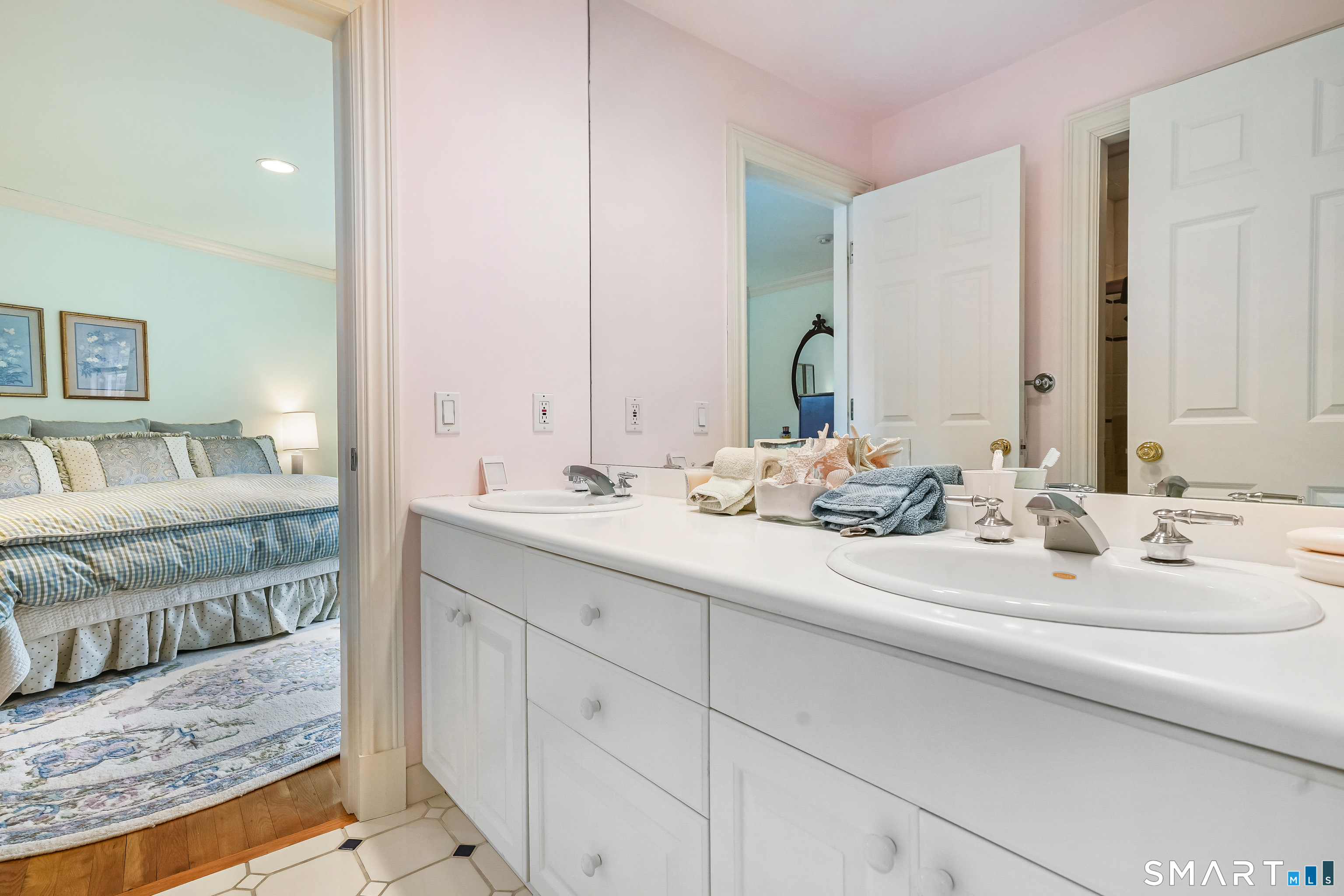 41 Lake Wind Road New Canaan, CT 06840 - Photo 19 of 38 a bathroom with double vanity sinks and a mirror