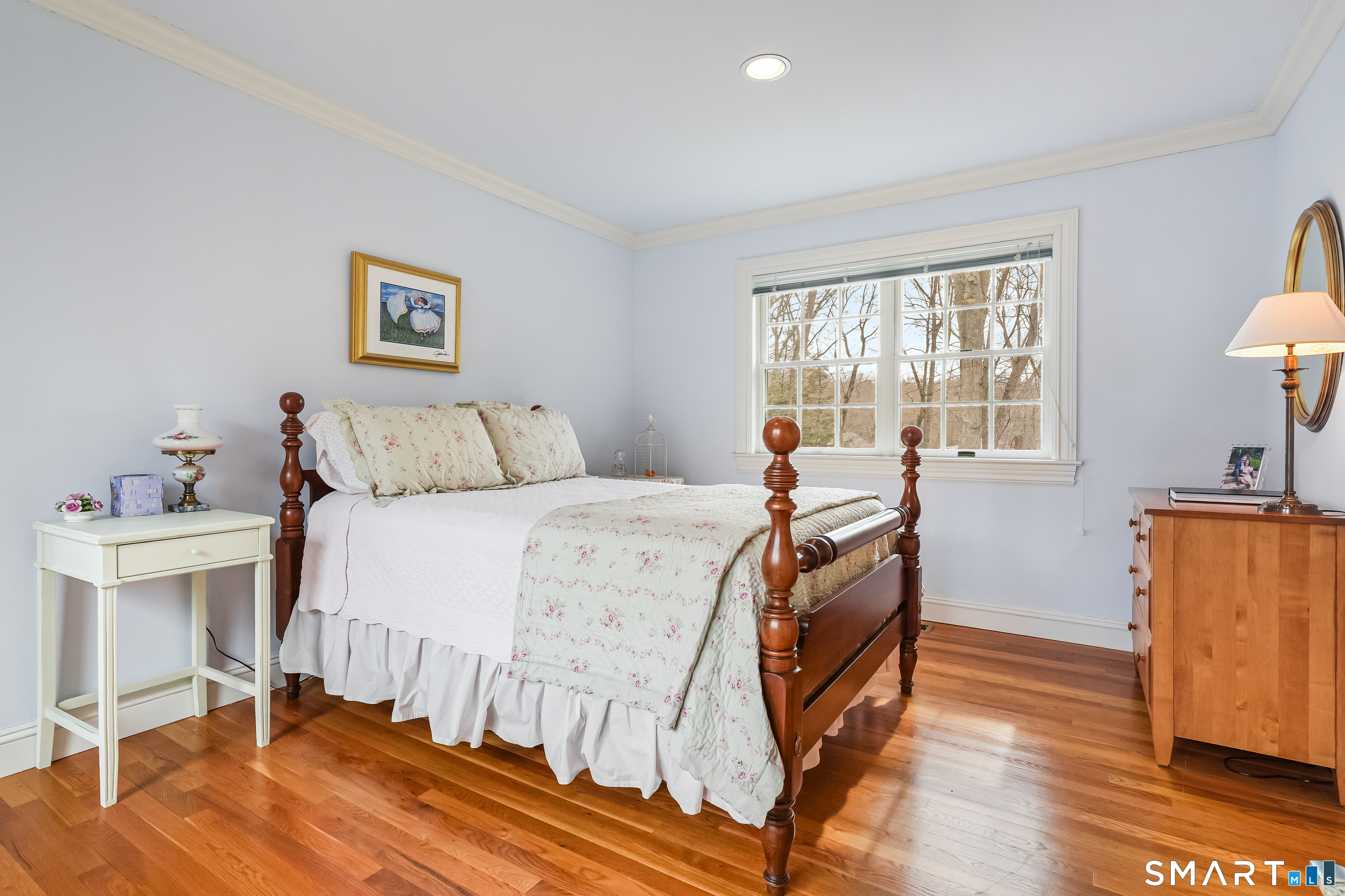 41 Lake Wind Road New Canaan, CT 06840 - Photo 21 of 38 a bedroom with a bed and wooden floor