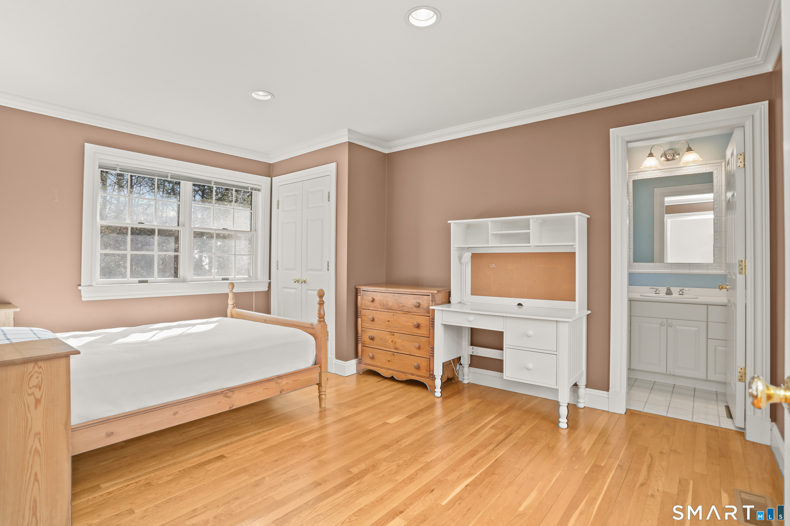 41 Lake Wind Road New Canaan, CT 06840 - Photo 22 of 38 a bedroom with a bed and a window