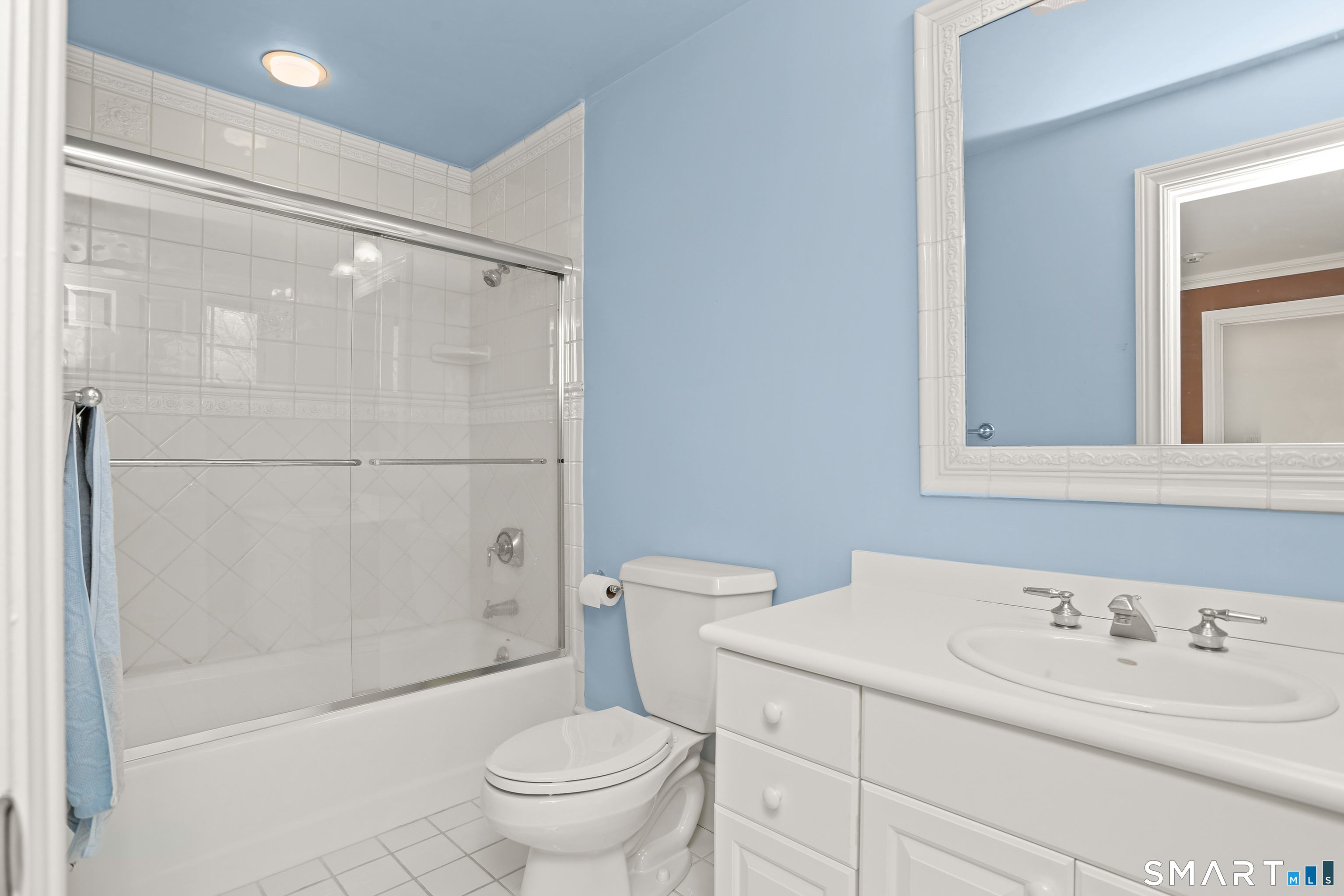 41 Lake Wind Road New Canaan, CT 06840 - Photo 23 of 38 a bathroom with a sink a toilet and shower