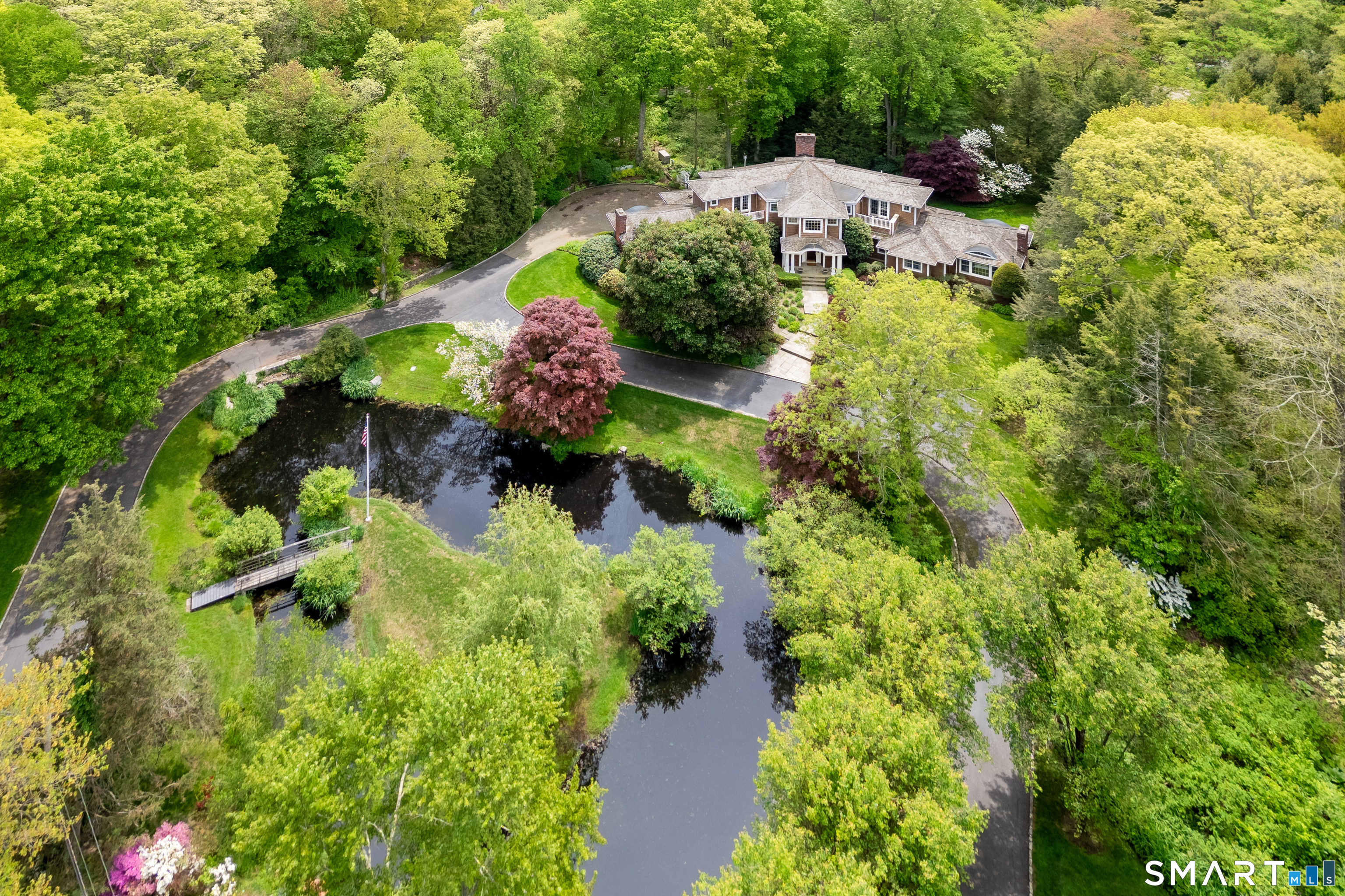 41 Lake Wind Road New Canaan, CT 06840 - Photo 3 of 38 an aerial view of residential house with outdoor space and trees all around