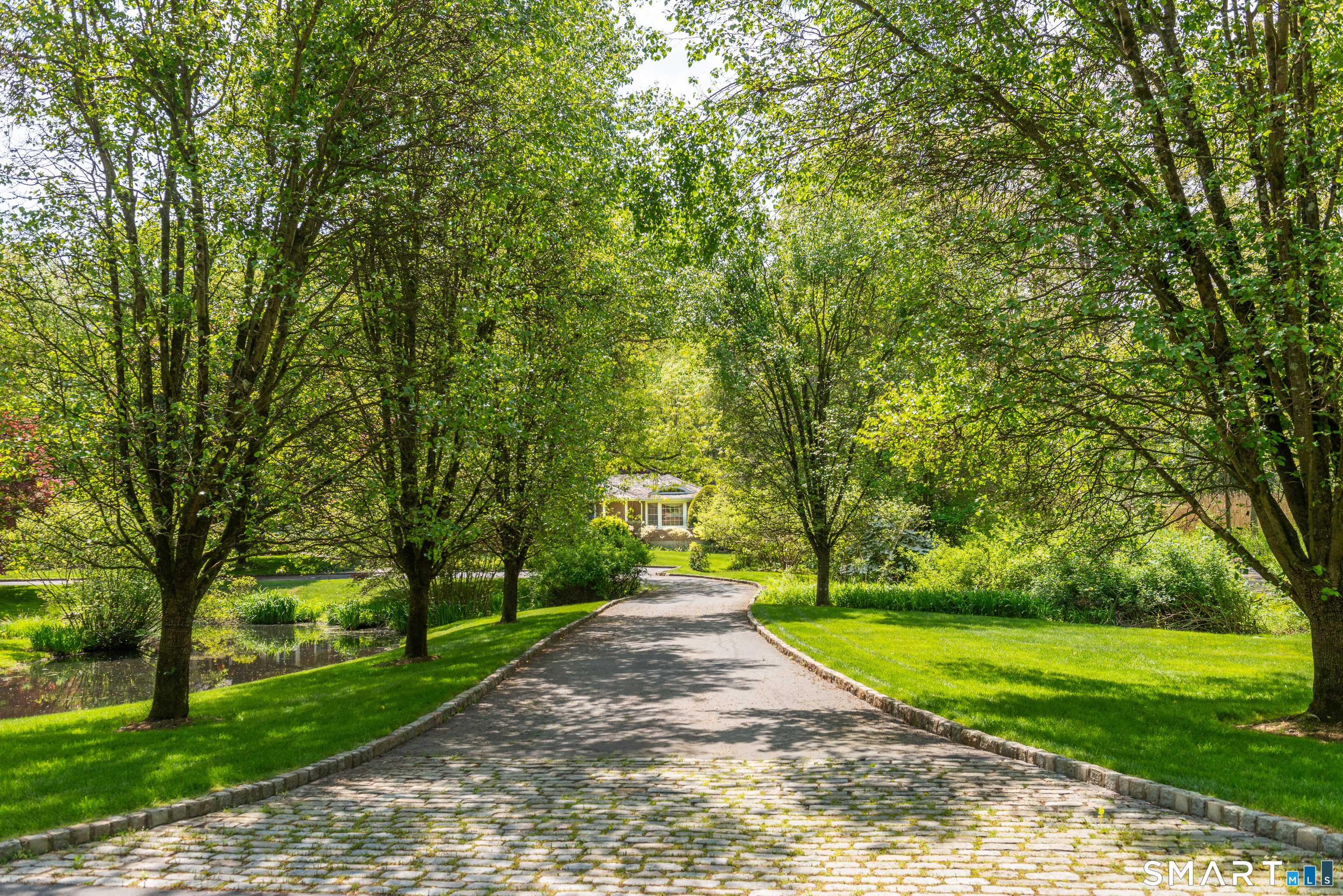 41 Lake Wind Road New Canaan, CT 06840 - Photo 35 of 38 a view of a park with large trees