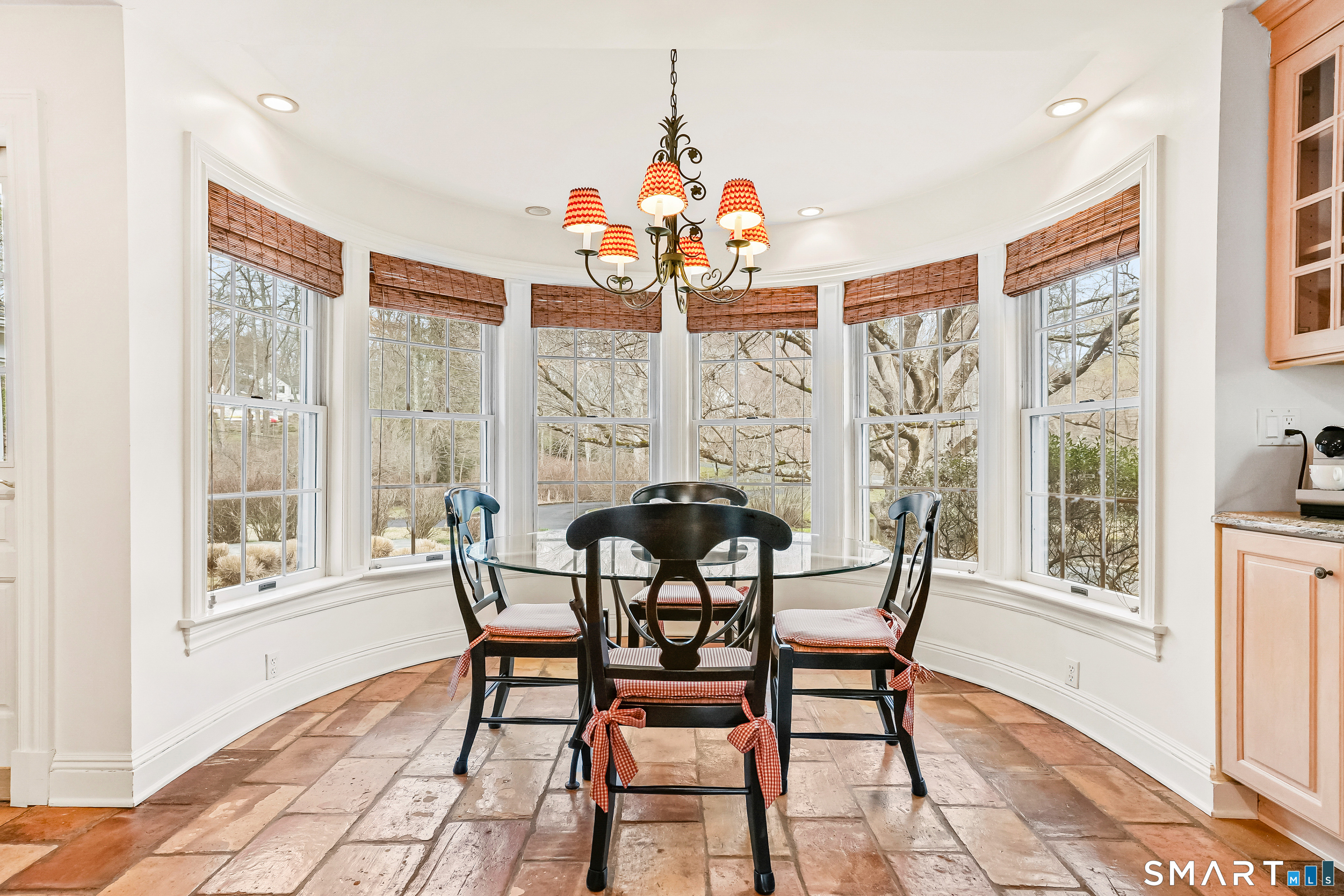 41 Lake Wind Road New Canaan, CT 06840 - Photo 8 of 38 a dining room with furniture a chandelier and wooden floor