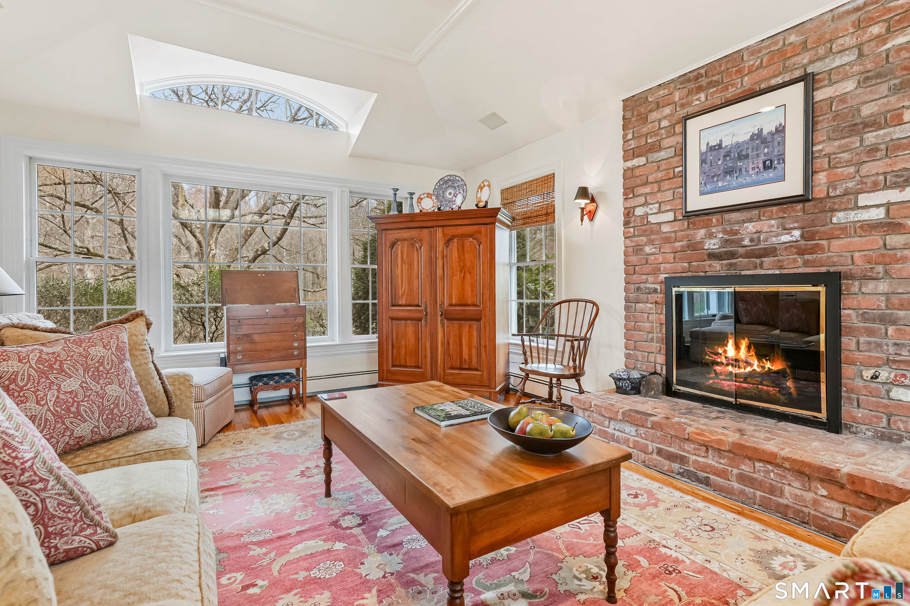 41 Lake Wind Road New Canaan, CT 06840 - Photo 9 of 38 a living room with furniture and a fireplace