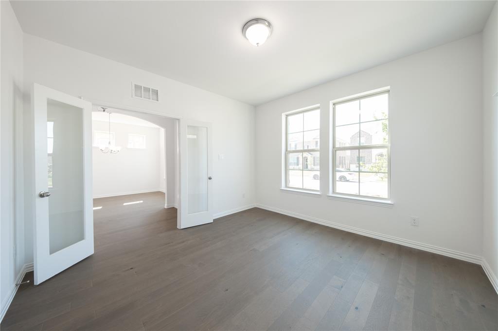 1413 Sun Gdn Way Justin, TX 76247 - Photo 21 of 36 an empty room with windows and closet