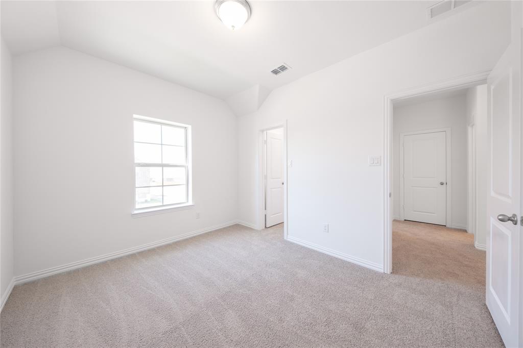 1413 Sun Gdn Way Justin, TX 76247 - Photo 25 of 36 an empty room with windows