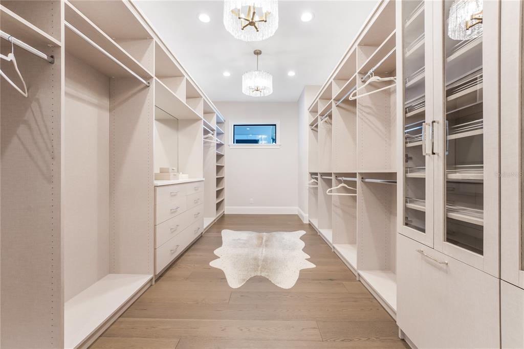 1621 Rio Vista Terrace Parrish, FL 34219 - Photo 14 of 27 a view of a hallway with white walls and chandelier