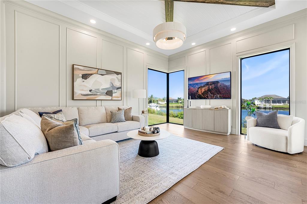 1621 Rio Vista Terrace Parrish, FL 34219 - Photo 17 of 27 a living room with furniture and a flat screen tv