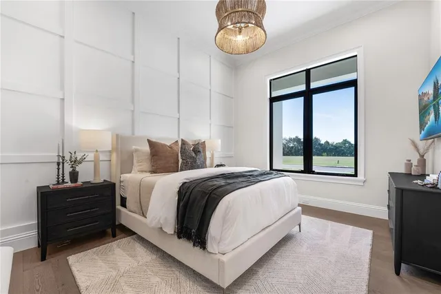 a bed room with bed and a tv