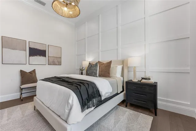 a bedroom with a bed and dresser