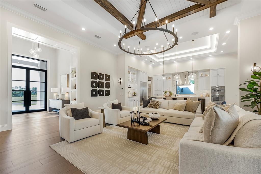 1621 Rio Vista Terrace Parrish, FL 34219 - Photo 4 of 27 a living room with furniture a clock and a ceiling fan