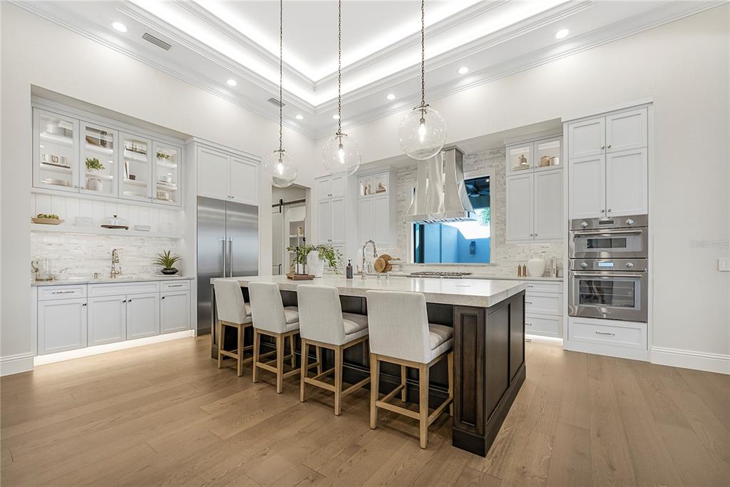 1621 Rio Vista Terrace Parrish, FL 34219 - Photo 8 of 27 a large kitchen with a table and chairs