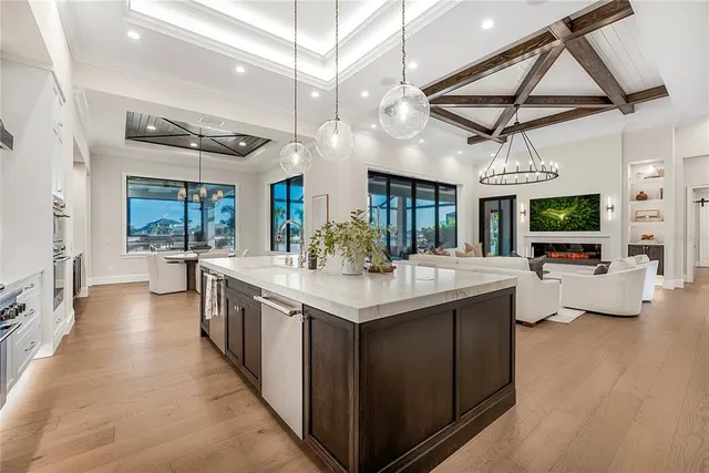 a kitchen with stainless steel appliances granite countertop a sink and a stove