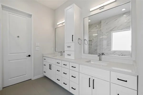 a bathroom with a bathtub and a sink