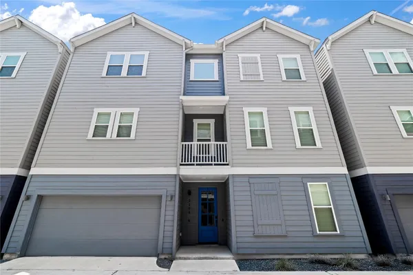 a view of a house with a street