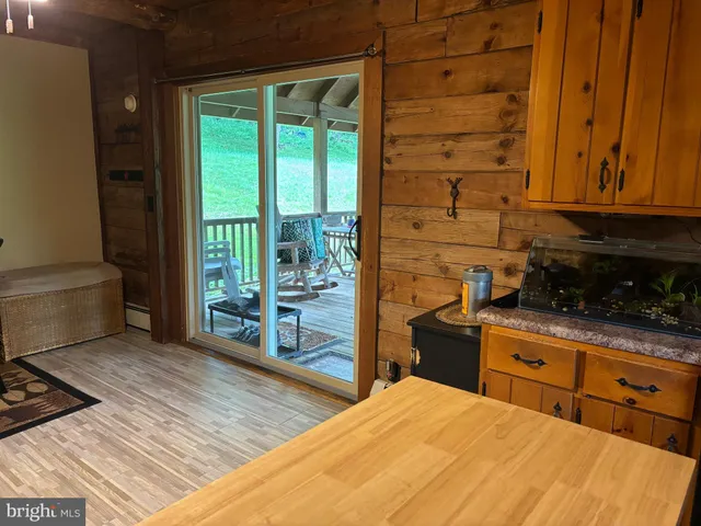 a kitchen with stainless steel appliances wooden cabinets and a stove top oven