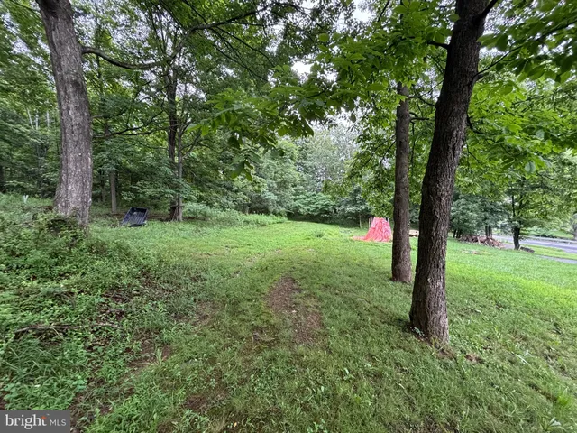 a aerial view of a house with a yard