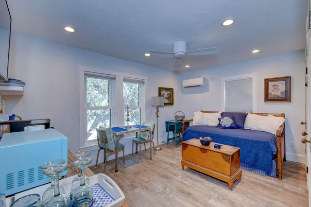 a living room with furniture a table and a window
