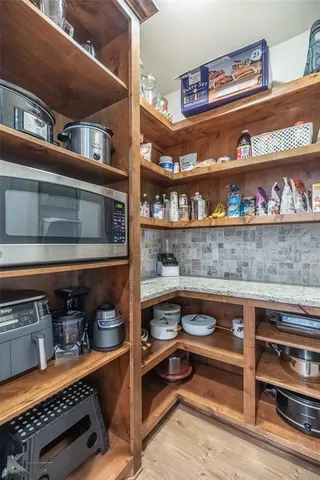 a kitchen with a stove and cabinets
