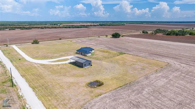 a view of a swimming pool and an outdoor space