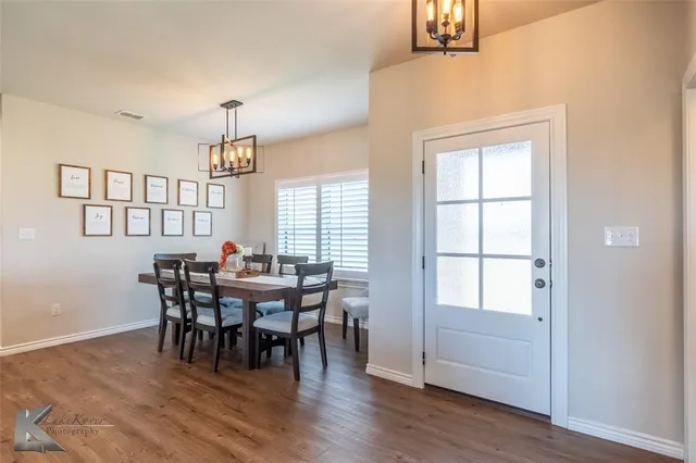 a view of a dining room with furniture and window