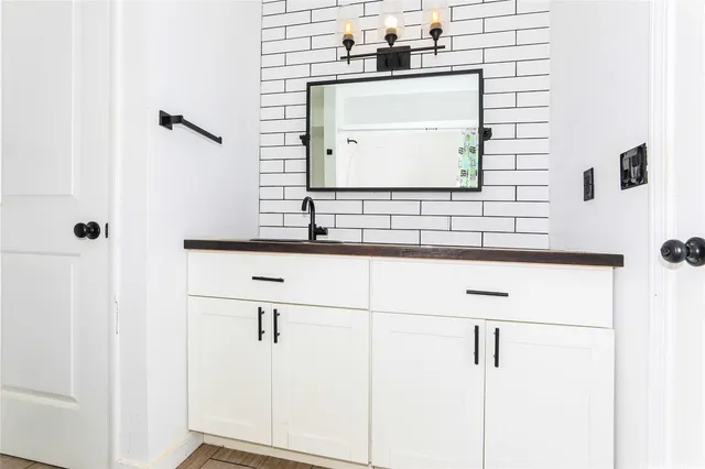 a bathroom with a sink and a mirror