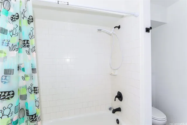 a bathroom with a shower curtain