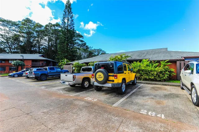 a view of a street with a car parked in front of it