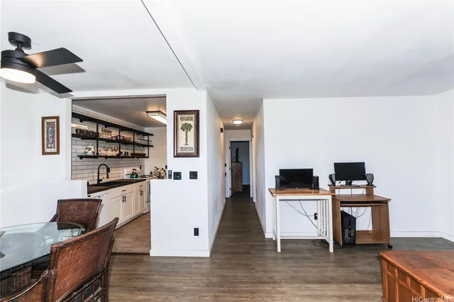 a kitchen with stainless steel appliances kitchen island granite countertop a stove and a refrigerator