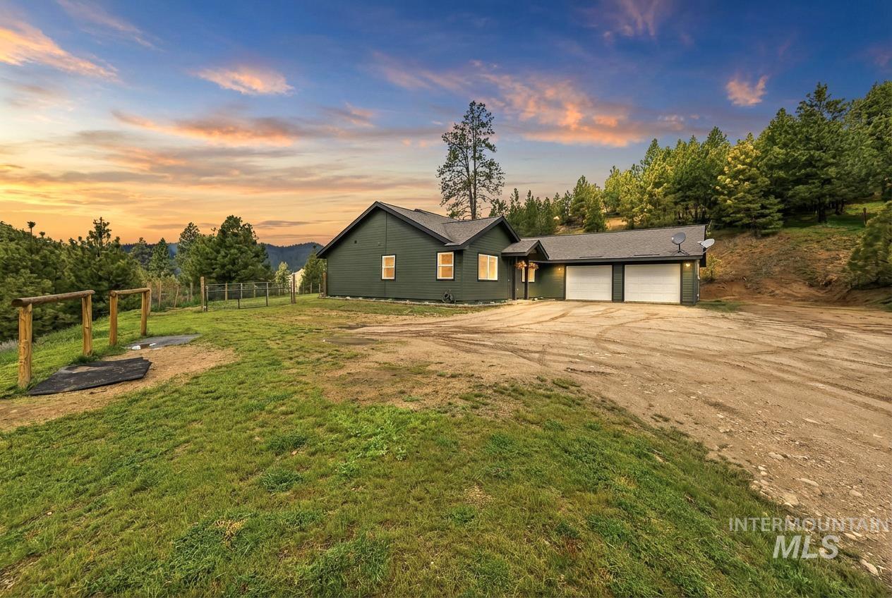 4 Round Up Circle Boise, ID 83716 - Photo 1 of 47 Dark green exterior featuring multiple windows and a two-car garage