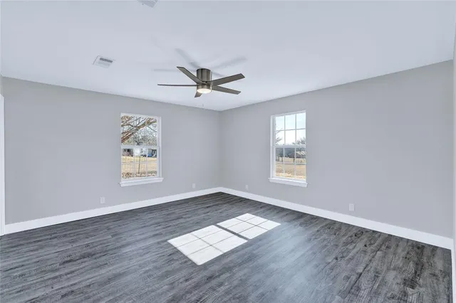 a view of workspace with wooden floor and window
