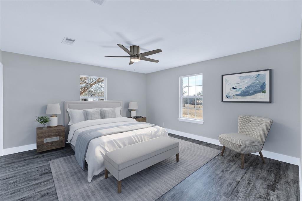 566 McCraw Lane Denison, TX 75021 - Photo 5 of 25 a spacious bedroom with a bed and a painting on the wall