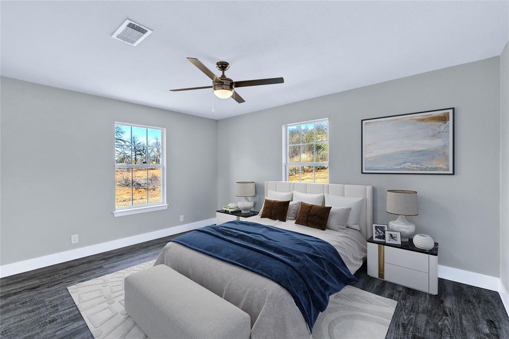566 McCraw Lane Denison, TX 75021 - Photo 6 of 25 a bedroom with a large bed and a window