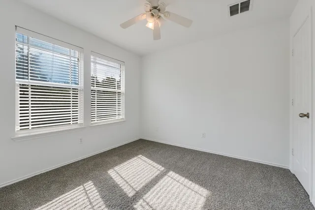 a view of a backyard with sitting area