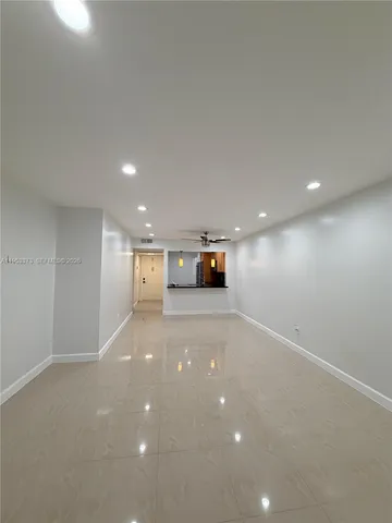 a view of empty room with a flat screen tv