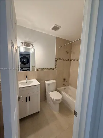 a bathroom with a sink toilet and vanity
