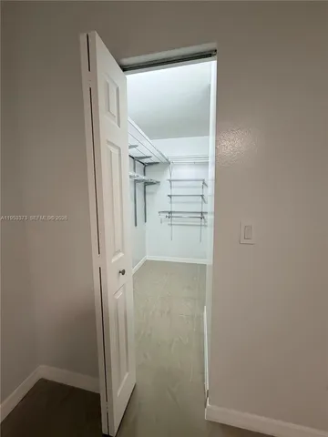 a bathroom with a shower curtain and a sink