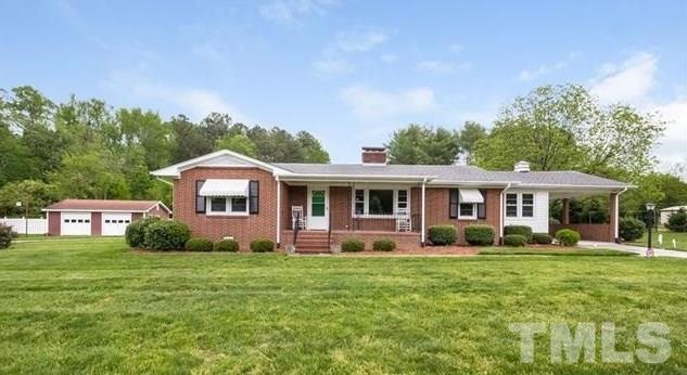 70 Spring Valley Road Henderson, NC 27537 - Photo 2 of 14 a front view of a house with garden