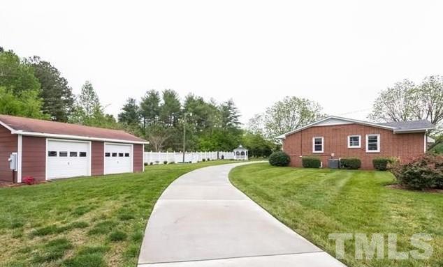 70 Spring Valley Road Henderson, NC 27537 - Photo 12 of 14 a house view with a garden space