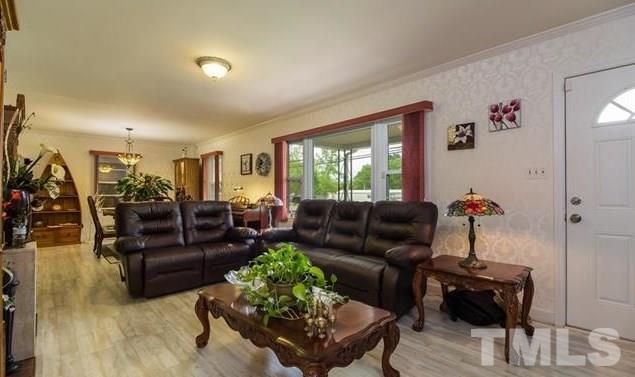 70 Spring Valley Road Henderson, NC 27537 - Photo 5 of 14 a living room with furniture and wooden floor