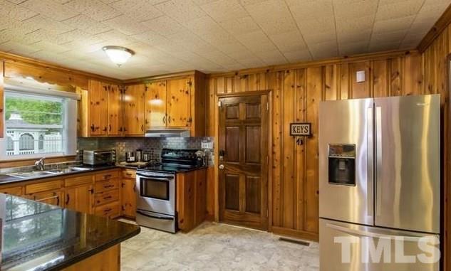70 Spring Valley Road Henderson, NC 27537 - Photo 7 of 14 a kitchen with stainless steel appliances granite countertop a refrigerator and a sink