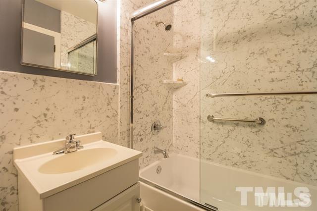 70 Spring Valley Road Henderson, NC 27537 - Photo 9 of 14 a bathroom with a sink and a shower