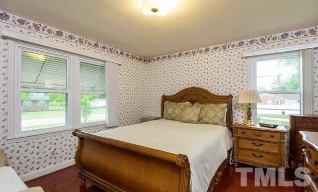 70 Spring Valley Road Henderson, NC 27537 - Photo 10 of 14 a bedroom with a bed and a window