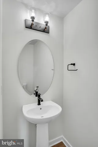 a bathroom with a sink and mirror