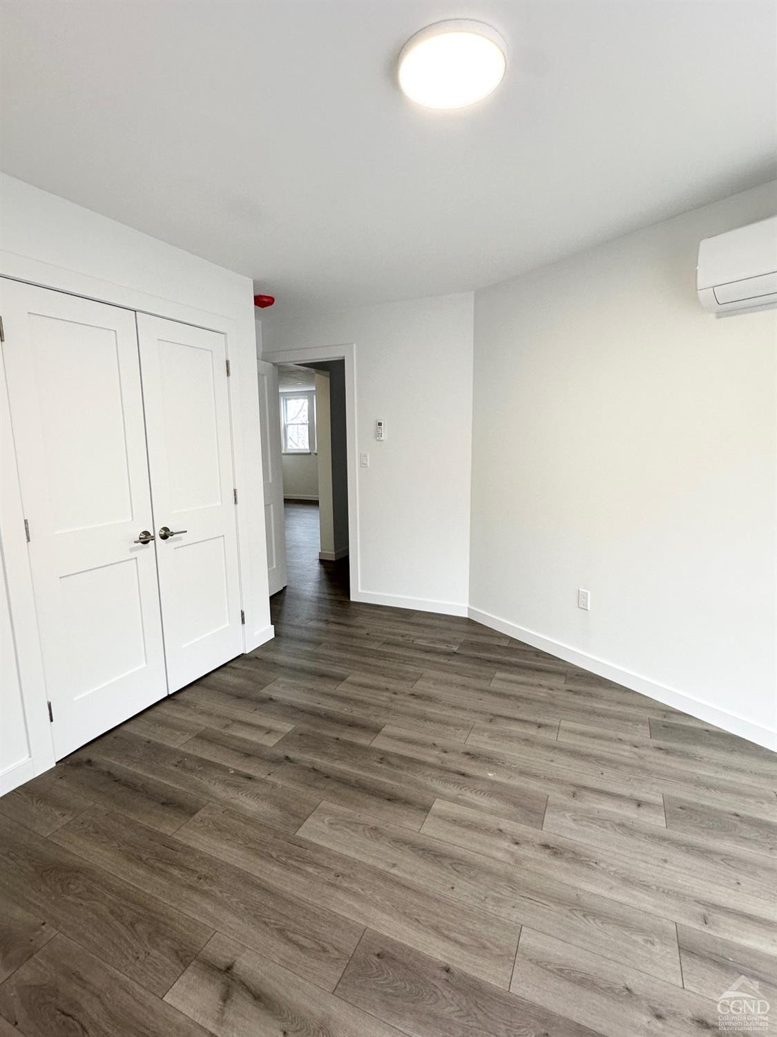 473 Main Street, Unit 1 Catskill, NY 12414 - Photo 5 of 11 a view of an empty room and wooden floor